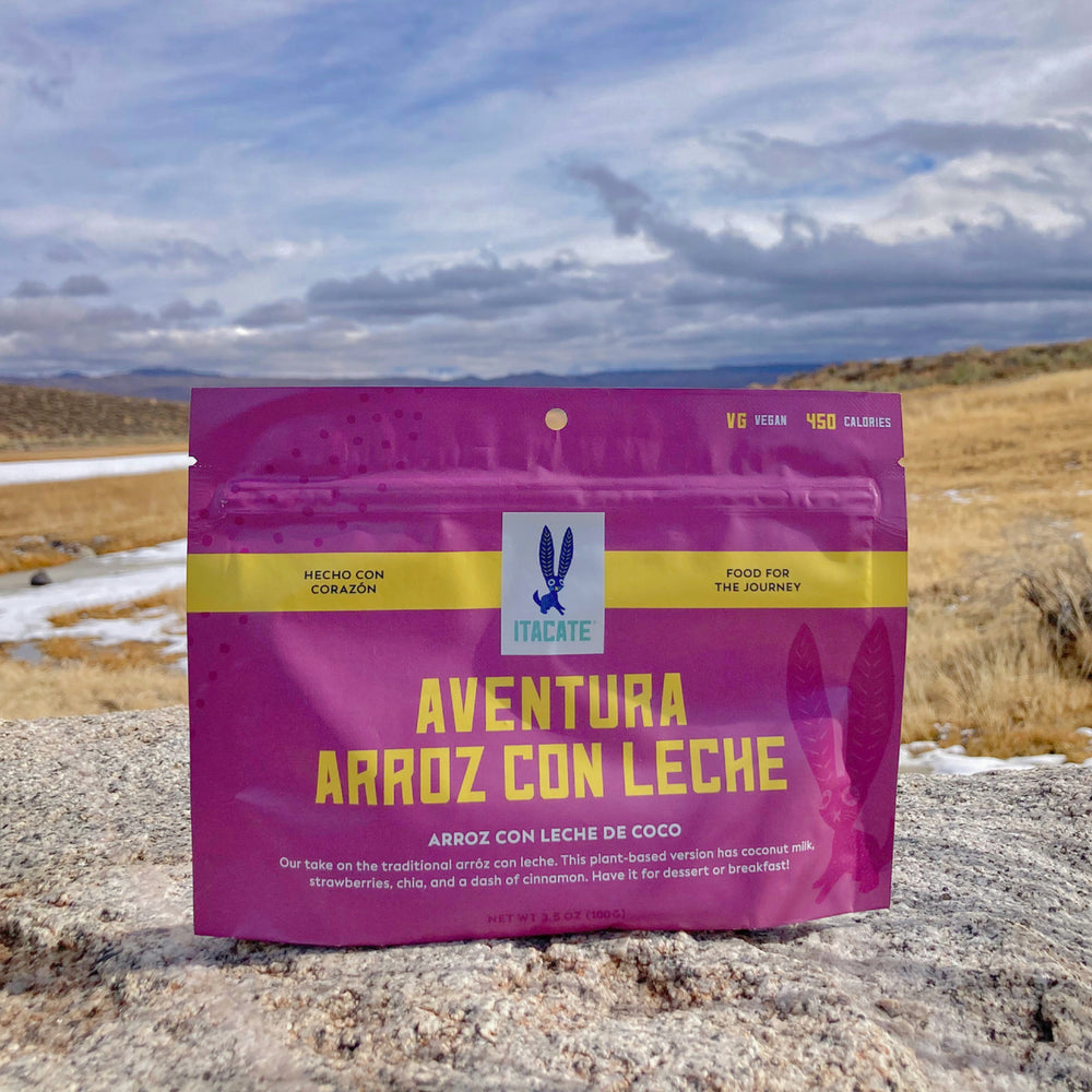 Arroz con leche backpacking pouch resting on a rock on the mountain