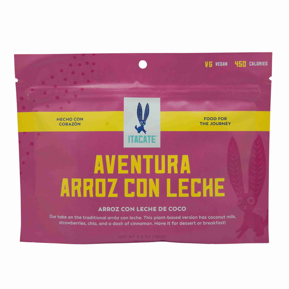 
                  
                    A package of Itacate Aventura Arroz con Leche, a vegan rice and milk product, with vibrant pink packaging, an image of a rice grain, and text highlighting the use of coconut milk, strawberries, chia, and cinnamon.
                  
                